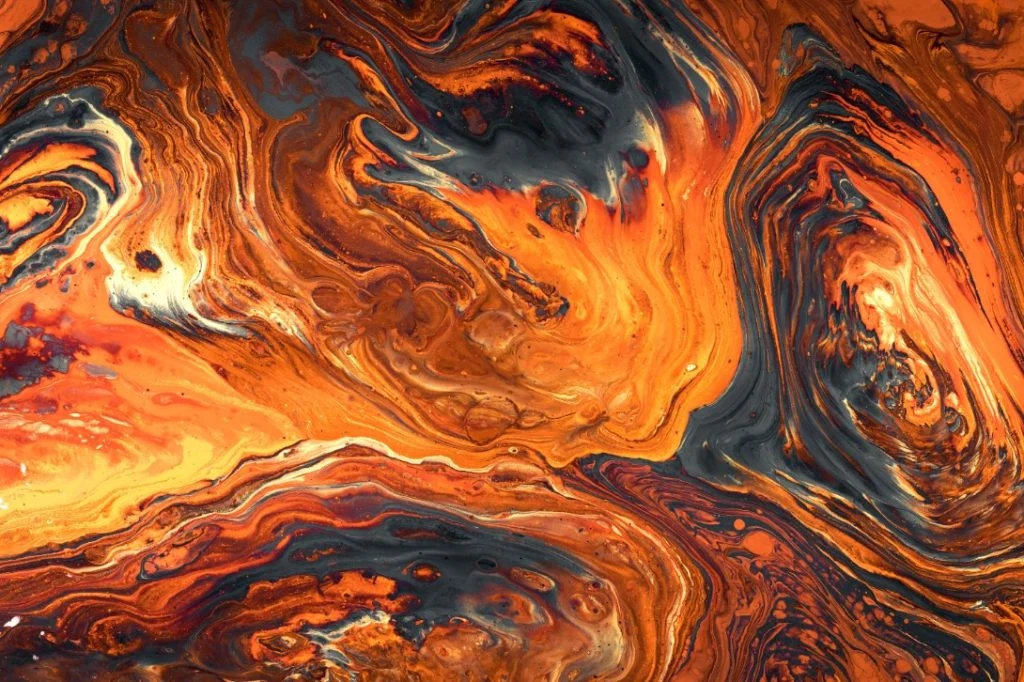 Textura abstracta en tonos naranja, negro y blanco